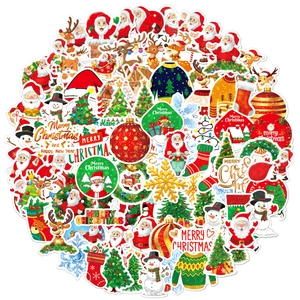 Close-up of holographic Christmas stickers with Santa and reindeer holiday elements
