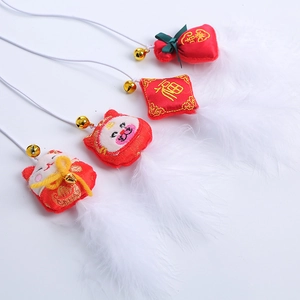 Cat feather wand toy with red festive pendants and bells for Chinese New Year