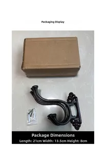 Detail of vintage cast iron wall hook with black mounting screws and box packaging