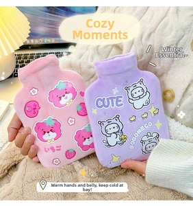 Close-up of pink and purple plush hot water bottles with cute cartoon animal patterns