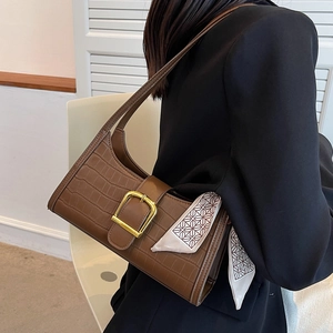 Brown crocodile embossed baguette bag with gold buckle and scarf on model