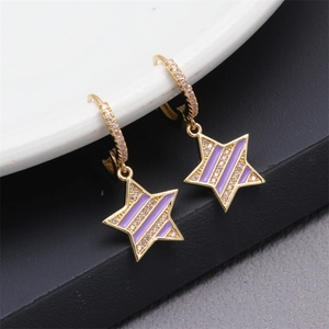 Detail of gold star earrings with purple stripes and sparkling crystal embellishments