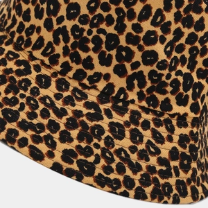 Detailed close-up showing the multi-stitch brim and leopard print corduroy texture on hat