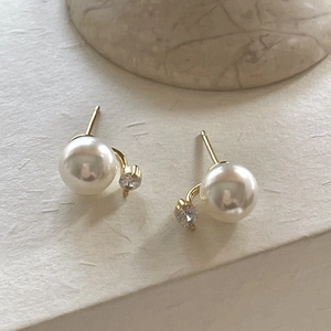 Minimalist 925 silver gold pearl zircon stud earrings on natural stone pedestal