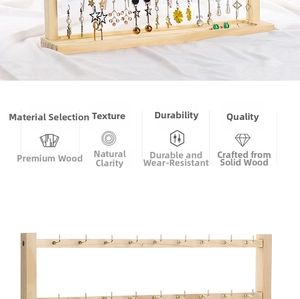 Detail of wooden earring display stand with tiered frame and metal hooks on white fabric