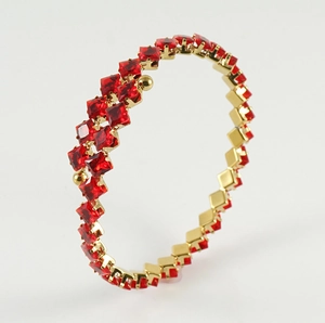 Detail of 18k gold plated bracelet featuring double row square red zircon stones