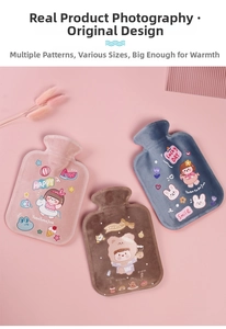 Close-up of three cute plush hot water bags in pink, brown and blue with cartoon prints