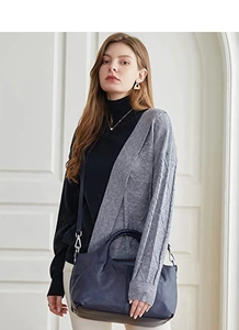Fashionable dark blue large capacity tote bag styled with a two-tone knit sweater