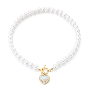 Elegant pearl necklace with gold heart pendant and shimmering rhinestones on white base