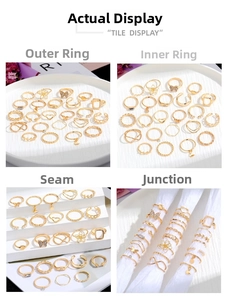 Detailed views of gold butterfly and pearl ring set showing texture and craftsmanship