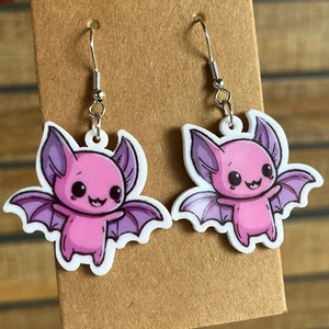 Pink cartoon bat acrylic earrings on display card with metal hooks for Halloween