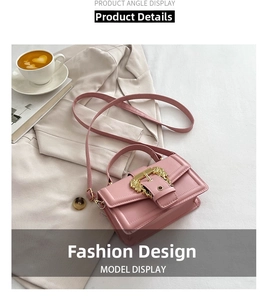 Close-up of pink square bag featuring intricate golden baroque style metal buckle detail