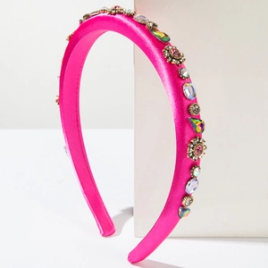 Fuchsia satin headband with colorful rhinestones and vintage crystals on white display