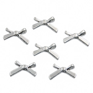 Detailed view of six silver hollow bow alloy pendants for DIY jewelry making