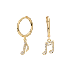 Detail view of golden music note earrings featuring white cubic zirconia on a white backdrop