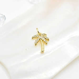 18k gold-plated palm tree pendant featuring micro-pave zircons on a seashell surface