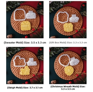 Detail of Christmas cookie molds showing sweater and wreath shapes with dough patterns