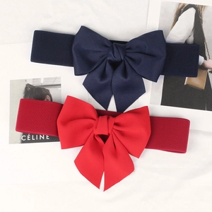 Elastic wide belt for women featuring a large bowknot in navy blue and vibrant red