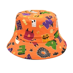 Detailed view of Halloween bucket hat with orange fabric and festive pumpkin patterns