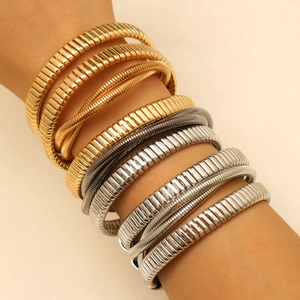 Multi-layered metallic Tubogas stretch bracelets in gold silver and gun black colors