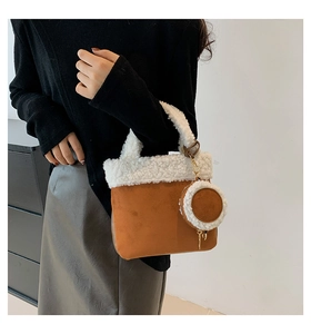 Brown suede and white faux shearling bucket bag with matching round coin purse detail