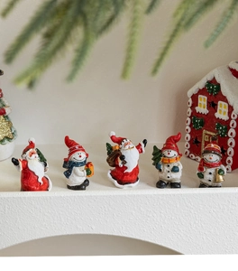 Detailed view of 5 mini resin Christmas figurines featuring Santa and Snowman decor