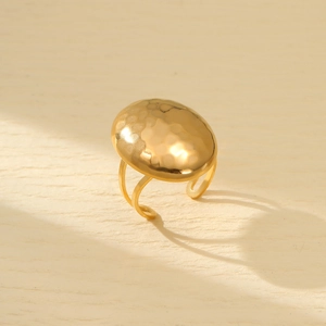 Minimalist gold stainless steel ring with hammered oval surface and open band design