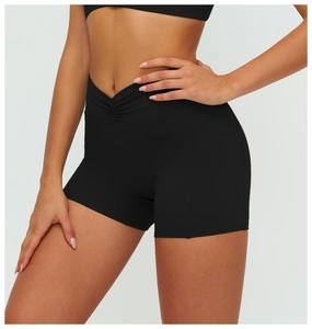 Macro shot of high-waist V-shaped ruched yoga shorts for women in matte black finish