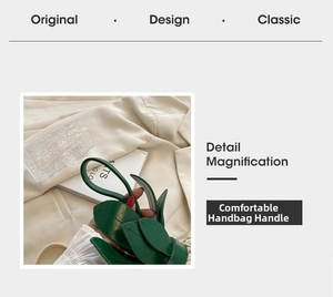Close-up of green leaf-shaped leather handle with detailed stitching on pineapple bag