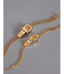 Three-layer gold bead chain bracelet featuring a stylish buckle charm in 18k gold finish
