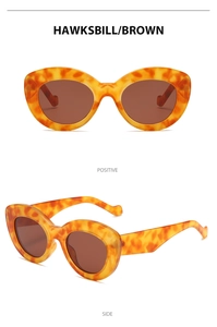 Front and side views of vintage Y2K cat-eye sunglasses in hawksbill frame and brown lens