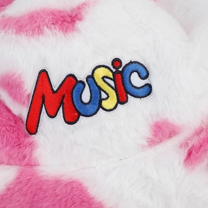 Pink cow print plush bucket hat with colorful MUSIC embroidery and note design
