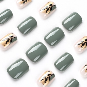 Short square press on nails set in Morandi green and white with gold foil leaf design