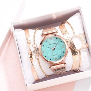 Detail of rose gold quartz watch set with mint green dial and matching bracelets in a box