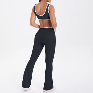 Detailed back view of high-waist flared yoga pants and racerback top with white piping