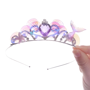 Detailed view of mermaid crown with purple gems, sea stars and pink iridescent shell