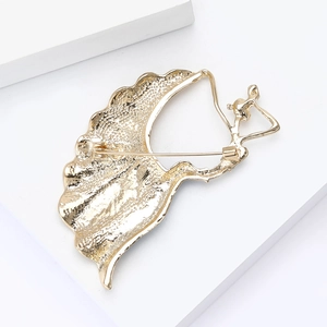 Detailed back view of a gold peacock brooch showing the secure pin and clasp mechanism
