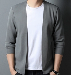 Detail of grey V-neck knit cardigan showing fine mesh texture and buttonless design