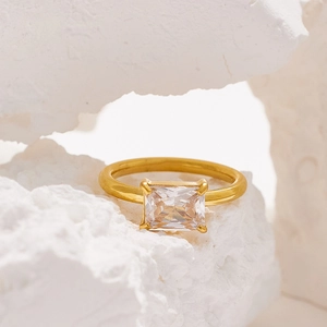Detailed shot of 18K gold plated stainless steel ring with rectangular zircon on stones