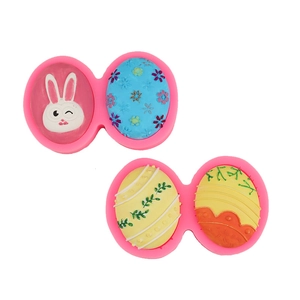 Detailed macro view of pink silicone Easter molds with rabbit and floral egg patterns