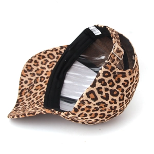 Detail view of leopard print baseball cap featuring gold metal buckle and inner wash tag