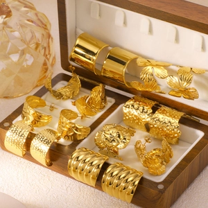 Golden C-shaped and textured stainless steel earrings set in a premium wooden jewelry box
