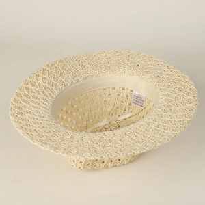 Detail view of woven straw hat interior with adjustable strap and cotton blend lining