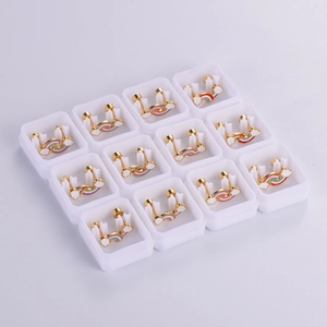 Set of 12 pairs of rainbow cloud stud earrings in individual white display gift boxes