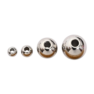 Set of four different sized stainless steel spacer beads with holes for DIY jewelry