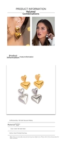 Detailed view of two-tone heart pendant earrings in gold and silver stainless steel