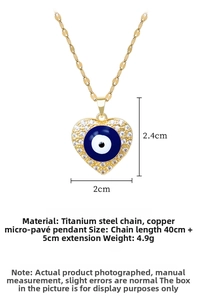 Detailed view of heart-shaped evil eye pendant with dimensions 2cm by 2.4cm and zircons