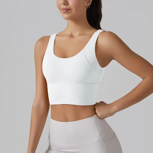 Detail of white high-impact sports bra featuring wide straps and breathable fabric