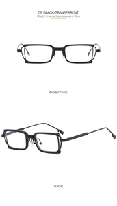 Detail of square black metal frame glasses with side cutouts and clear lenses