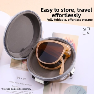 Detail of portable foldable amber sunglasses inside a gray round zipper storage case